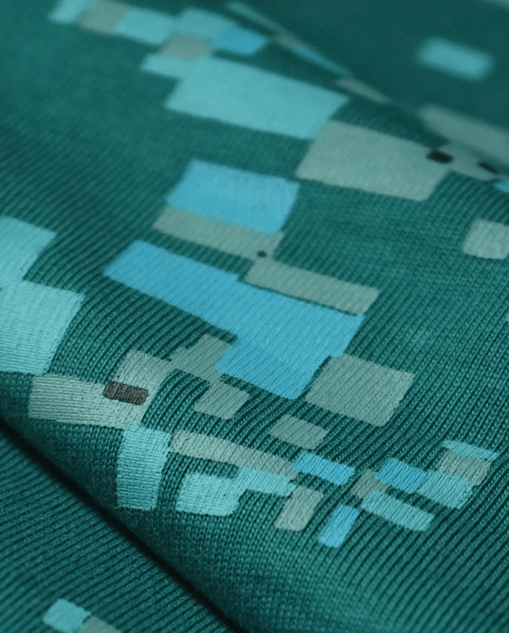 Texture detail of green 220 GSM cotton single jersey fabric, oversized fit - VYVHR