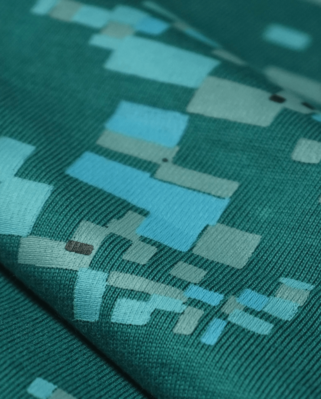 Texture detail of green 220 GSM cotton single jersey fabric, oversized fit - VYVHR