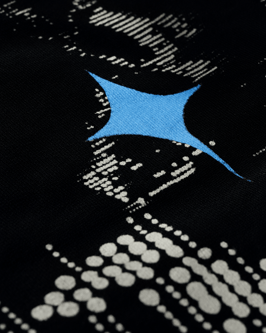 Texture close-up of black 240 GSM cotton single jersey fabric, dense structured drape - VYVHR
