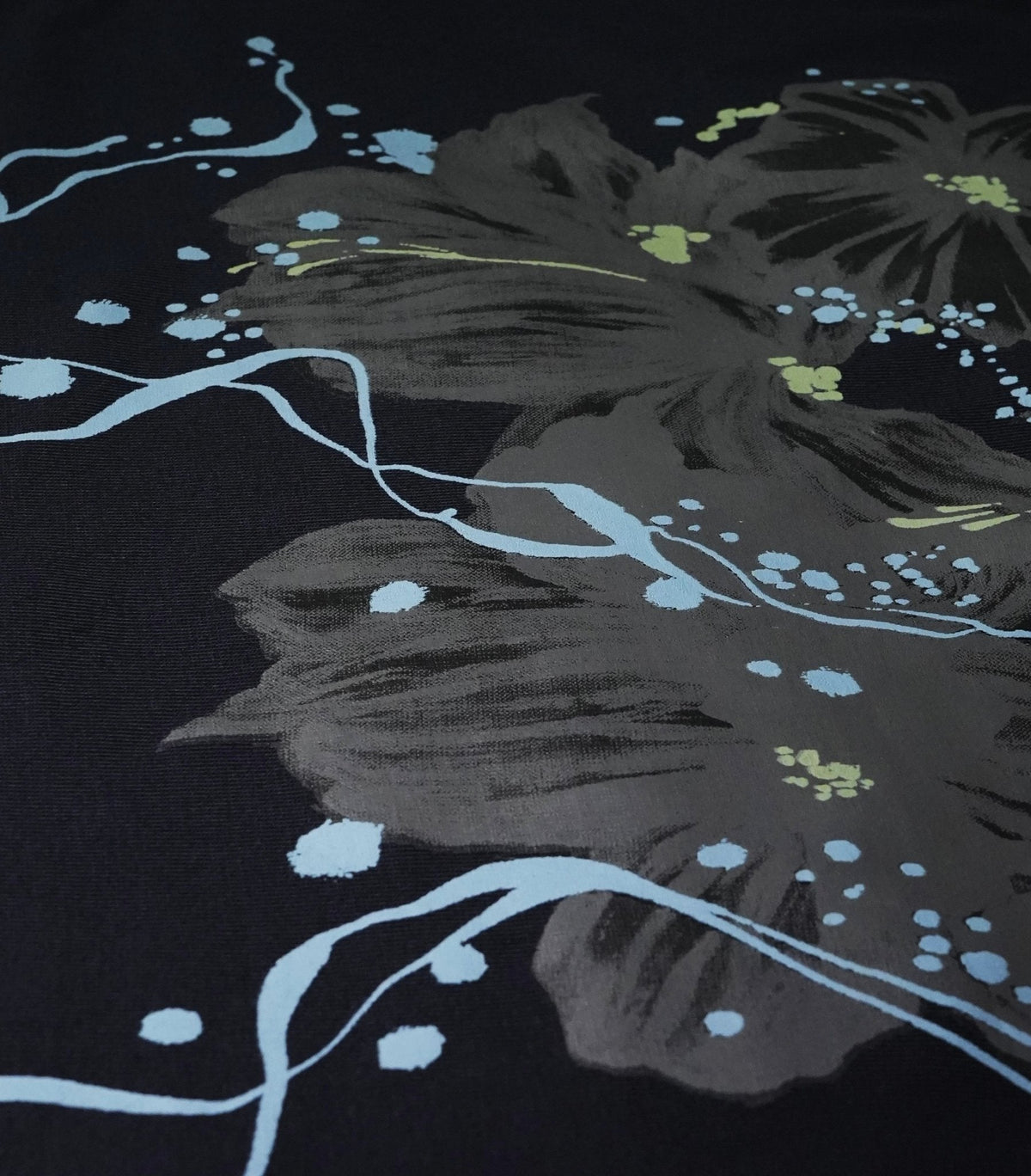 Texture close-up of navy 240 GSM cotton single jersey fabric on oversized t-shirt - VYVHR