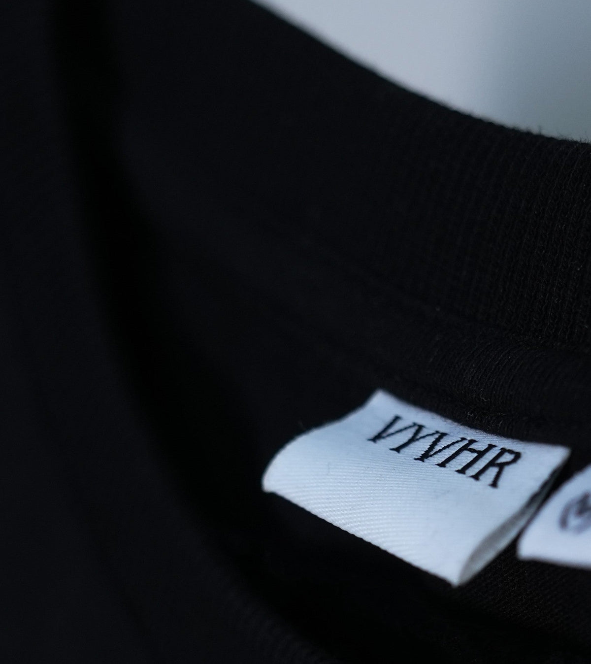 VYVHR neck label detail on black oversized cotton t-shirt